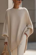 Women's knitted jumper in beige with an oversized fit, styled for casual and smart-casual outfits.