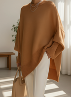 Women's knitted jumper in brown with an oversized fit, styled for casual and smart-casual outfits.