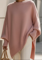 Women's knitted jumper in pink with an oversized fit, styled for casual and smart-casual outfits.