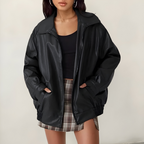 Women's oversized leather jacket in black with dropped shoulders, styled for casual and smart-casual outfits.