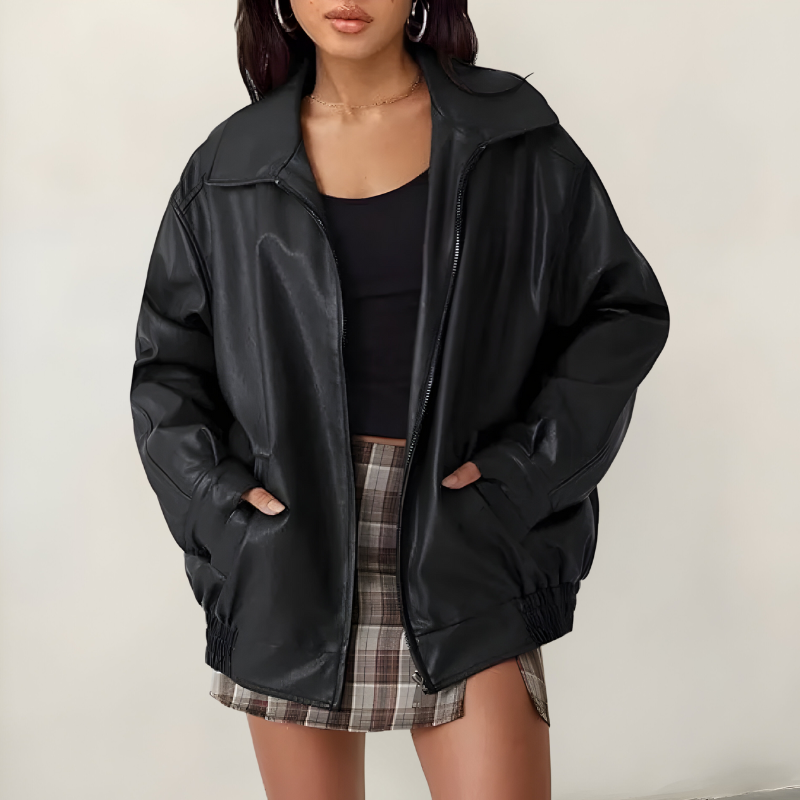 Women's oversized leather jacket in black with dropped shoulders, styled for casual and smart-casual outfits.