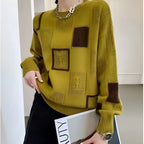 Women's patchwork jumper in white with panelled design, styled for casual and smart-casual outfits.