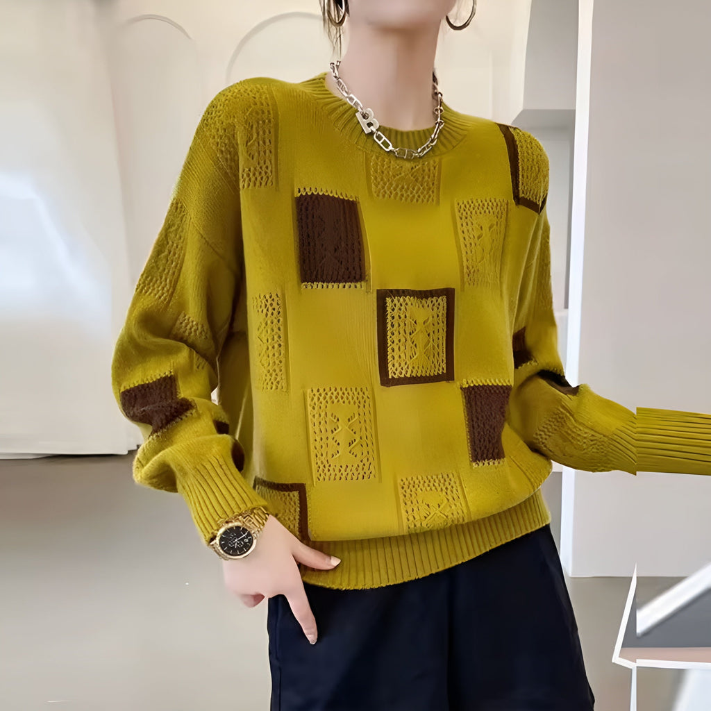 Women's patchwork jumper in yellow with panelled design, styled for casual and smart-casual outfits.