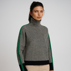 Women's roll-neck jumper in green with all-over print, styled for casual and smart-casual outfits.