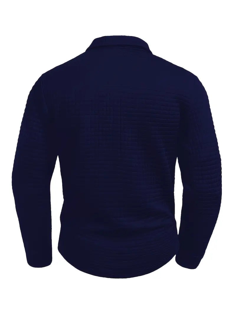 Men’s quilted jumper in blue with quilted panel detail, styled for casual and smart-casual outfits.
