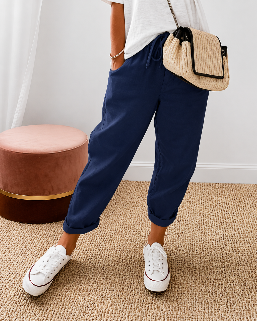 Women's relaxed fit trousers in navy with elasticated waist, styled for casual and smart-casual outfits.