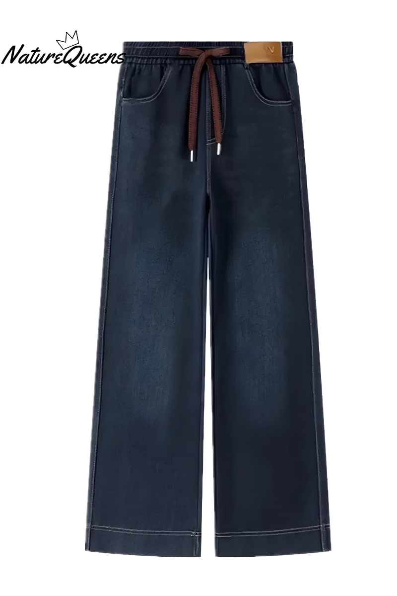 Women's stretch denim trousers in blue with an elasticated waistband, styled for casual and smart-casual outfits.