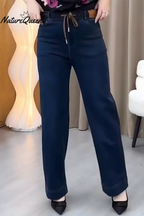 Women's stretch denim trousers in blue with an elasticated waistband, styled for casual and smart-casual outfits.