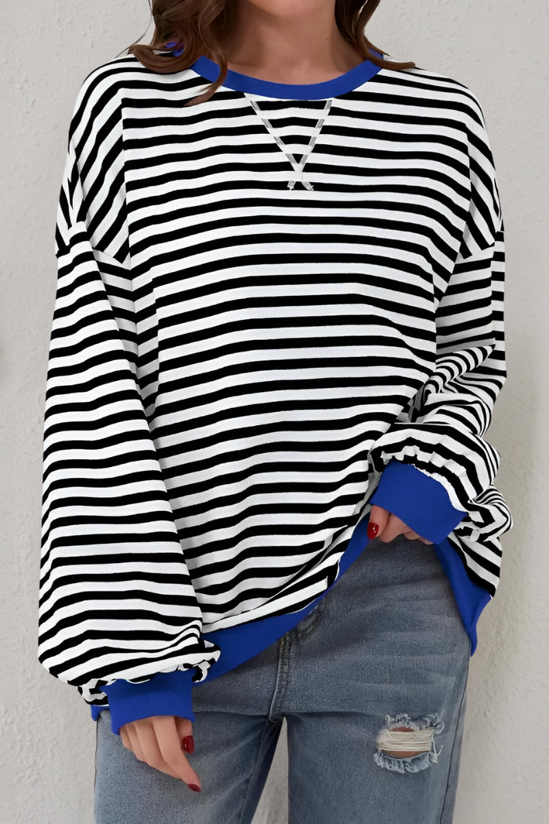 Women's sweatshirt in black with striped pattern, styled for casual and smart-casual outfits.