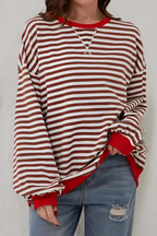 Women's sweatshirt in brown with striped pattern, styled for casual and smart-casual outfits.