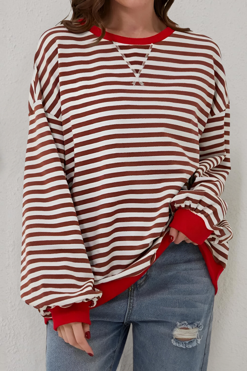 Women's sweatshirt in brown with striped pattern, styled for casual and smart-casual outfits.