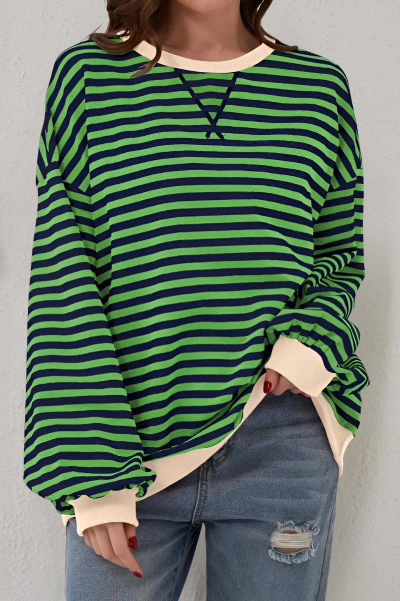 Women's sweatshirt in dark green with striped pattern, styled for casual and smart-casual outfits.