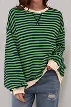 Women's sweatshirt in dark green with striped pattern, styled for casual and smart-casual outfits.