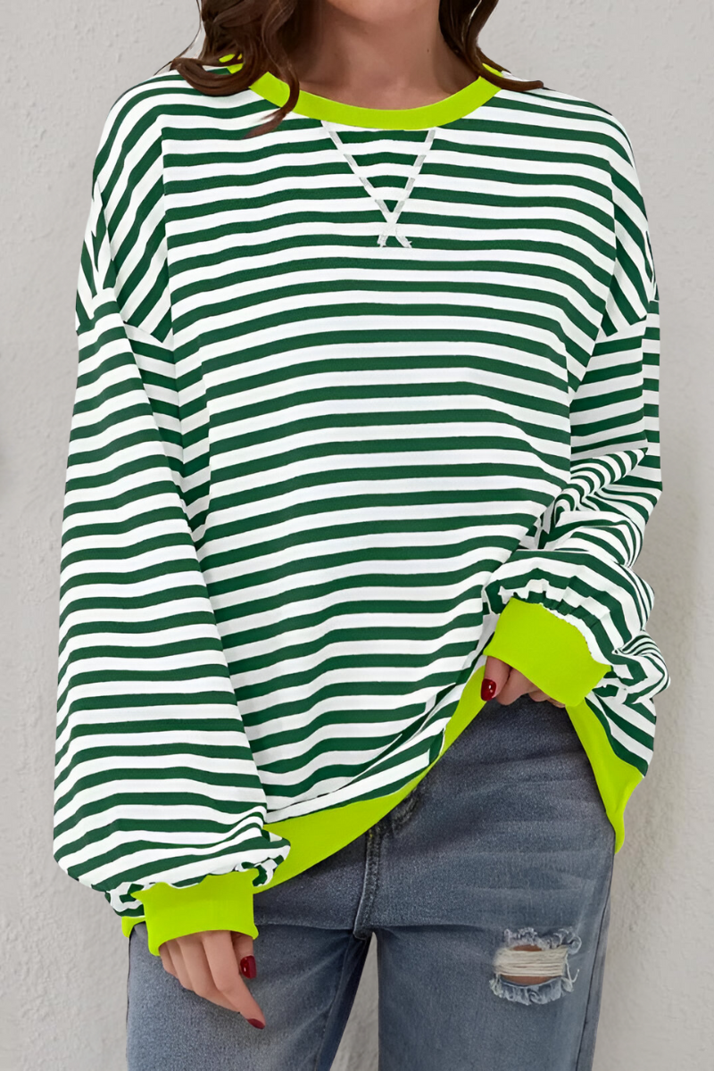 Women's sweatshirt in green with striped pattern, styled for casual and smart-casual outfits.