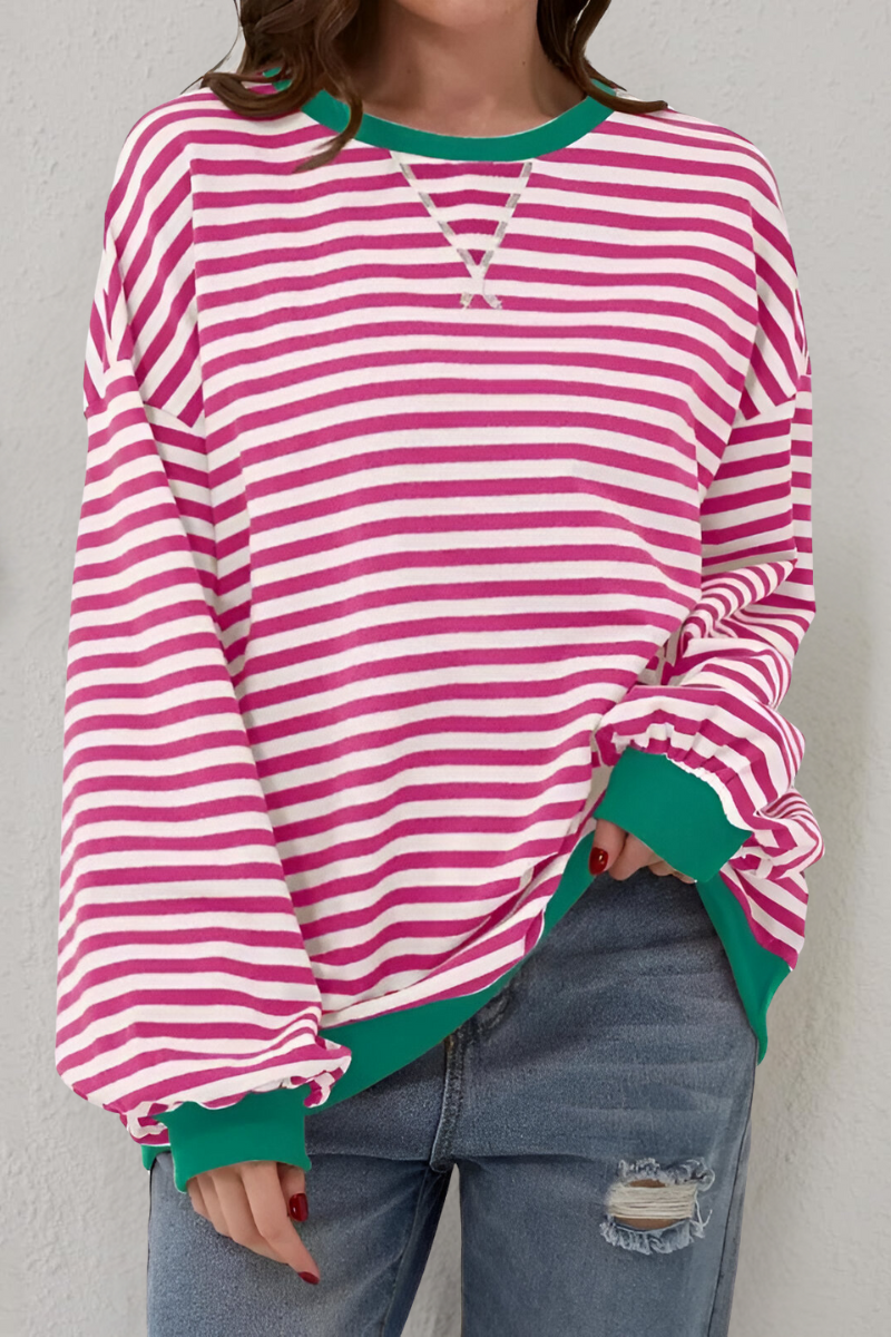 Women's sweatshirt in light pink with striped pattern, styled for casual and smart-casual outfits.