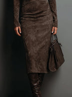 Women's midi dress in brown with a tailored waist, styled for casual and smart-casual outfits.