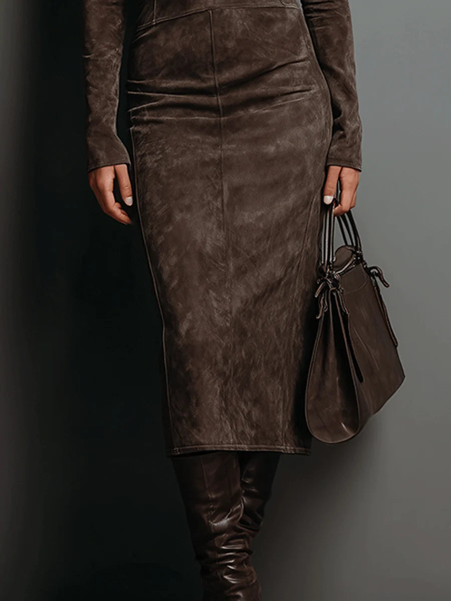Women's midi dress in brown with a tailored waist, styled for casual and smart-casual outfits.