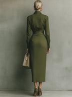 Women's wrap dress in green with a tailored waist, styled for casual and smart-casual outfits.