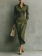 Women's wrap dress in green with a tailored waist, styled for casual and smart-casual outfits.