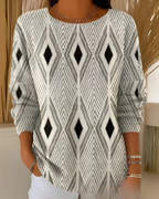 Women's knit jumper in beige with textured surface detail, styled for casual and smart-casual outfits.