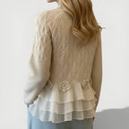 Women's jumper in beige with textured ruffle detailing, styled for casual and smart-casual outfits.