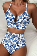 Women's bikini set in green with high-waisted bottoms, styled for beach and poolside outfits.