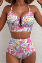 Women's bikini set in pink with high-waisted bottoms, styled for beach and poolside outfits.