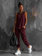 Women's two-piece casual set in wine red with sleeveless top, styled for casual and smart-casual outfits.