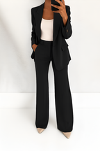 Women's two-piece suit set in black with tailored blazer, styled for work and smart-casual outfits.