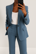 Women's two-piece suit set in blue with tailored blazer, styled for work and smart-casual outfits.