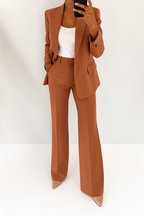 Women's two-piece suit set in brown with tailored blazer, styled for work and smart-casual outfits.