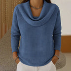 Women's waffle knit jumper in blue with cowl neck, styled for casual and smart-casual outfits.