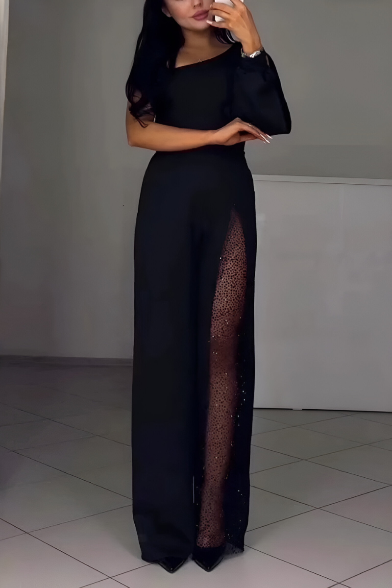 Women's jumpsuit in black with wide-leg trousers, styled for casual and smart-casual outfits.