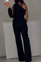 Women's jumpsuit in black with wide-leg trousers, styled for casual and smart-casual outfits.