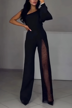 Women's jumpsuit in black with wide-leg trousers, styled for casual and smart-casual outfits.